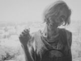 grayscale photo of female zombie