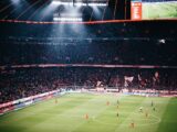 people watching football game on stadium