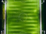 bird's-eye view photography of green soccer field with lights