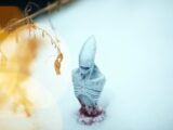 white angel figurine on white surface