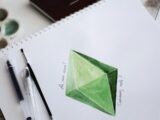 green sticky note on white paper