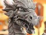 gray dragon statue in tilt shift lens