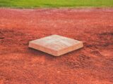 square brown concrete baseball base on soil
