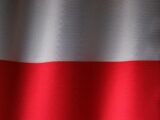 a close up of a red and white curtain