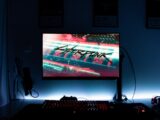 a computer monitor sitting on top of a desk