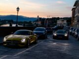 yellow porsche 911 on road during sunset