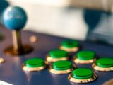 a close up of a game board with green buttons