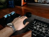 a person is typing on a computer keyboard