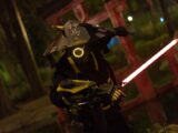 A captivating image of a futuristic samurai warrior cosplay illuminated by neon lights in a night environment.