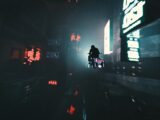 a person riding a motorcycle down a street at night