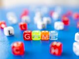 red white yellow and blue plastic dice