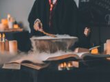 person holding wand on top of bowl