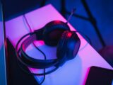 black and red corded headphones on white table