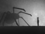 a person standing in front of a giant spider