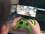 a person playing a video game on a laptop