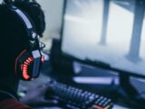 person wearing orange and black headphones