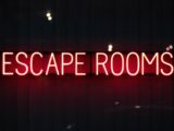 red escape rooms neon sign