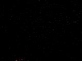 Tiny lights scattered across a dark background