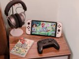 a nintendo wii game system sitting on top of a wooden table