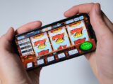 Someone is playing a mobile slot machine game.