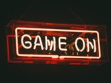 red and white Game On LED signage