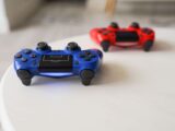 Close-up of PlayStation controllers on a white table for gaming enthusiasts.