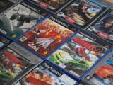 a pile of video games sitting on top of a table