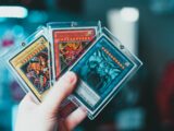 person holding yu gi oh trading card