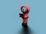 a toy figure with a gun