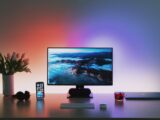 black flat screen computer monitor on brown wooden desk