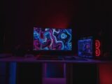 black flat screen computer monitor turned on displaying desktop