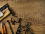 brown wooden handle gray metal tool