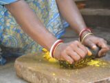 a close up of a person cutting food on a cutting board
