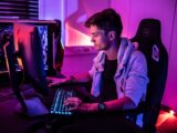 a man sitting in front of a computer keyboard