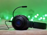 black and blue headphones on brown wooden table