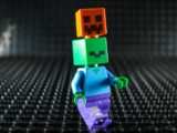 Lego character with pumpkin and zombie heads stacked