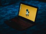 powered-on black laptop computer displaying home screen