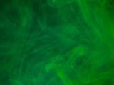 a green background with a lot of smoke