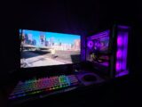 Gaming PC setup with monitor, game, and colorful rgb lighting